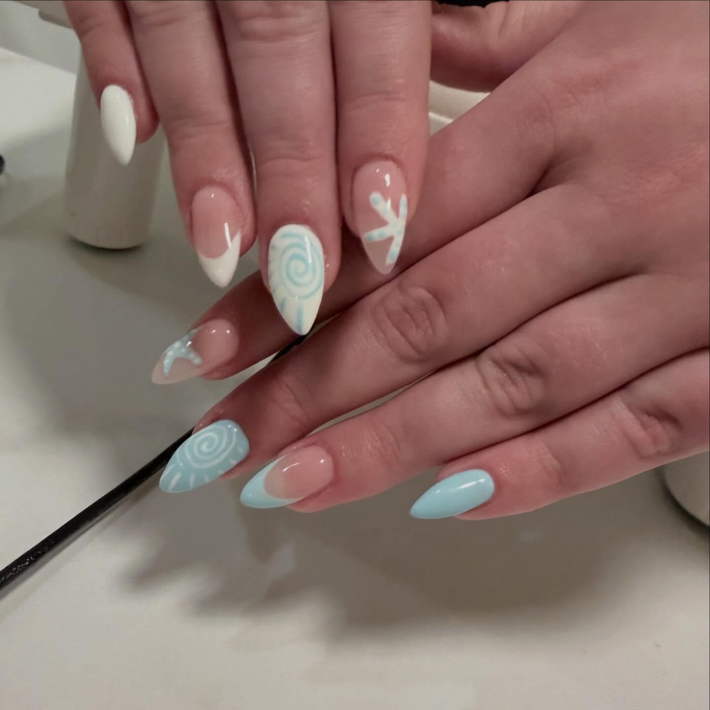 Glassy blue and white swirl nail art by Robin